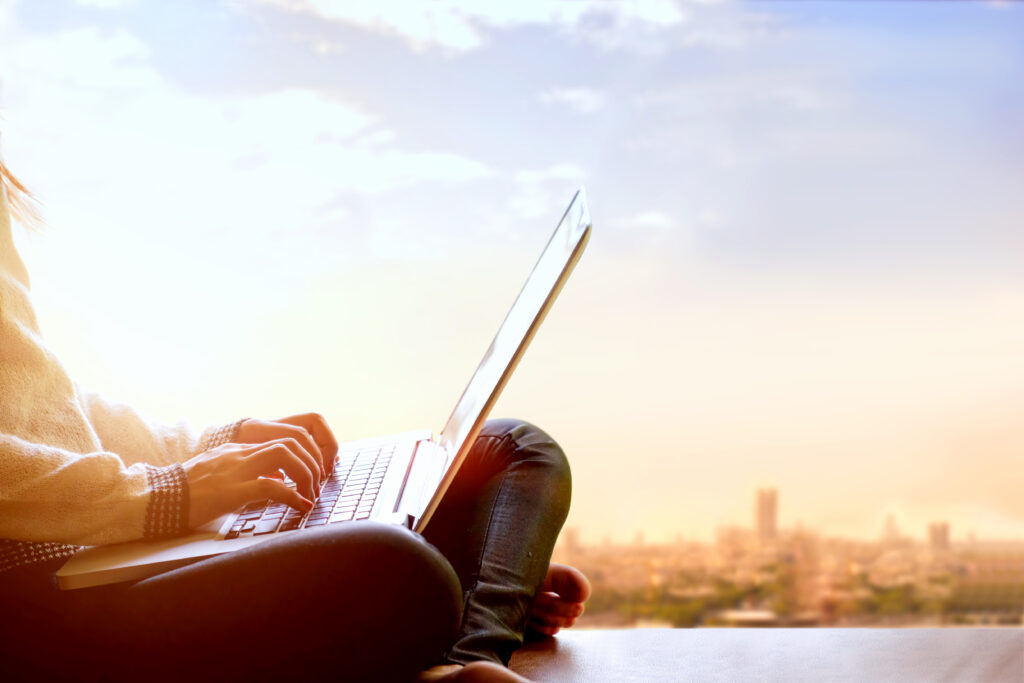 Focused girl on a laptop, passionately creating captivating website designs for seamless digital experiences and brand success.